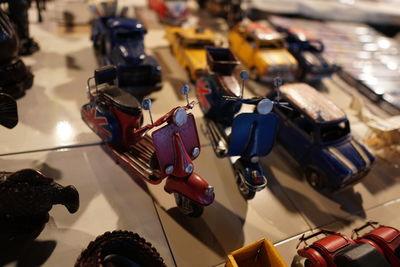 High angle view of toy motor scooters on table