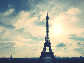 Low angle view of eiffel tower against sky during sunset