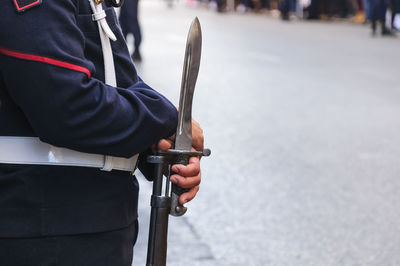 Man holding bayonette