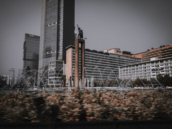 Low angle view of buildings against sky in city