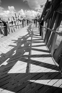 Shadow of people on boardwalk