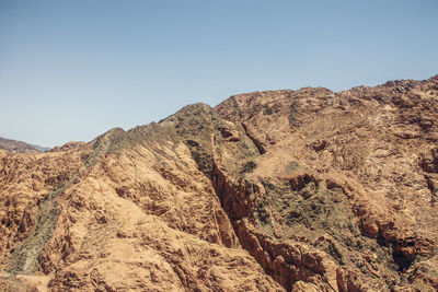 Scenic view of mountain range against clear sky