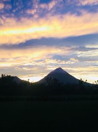 Scenic view of mountains against sky during sunset