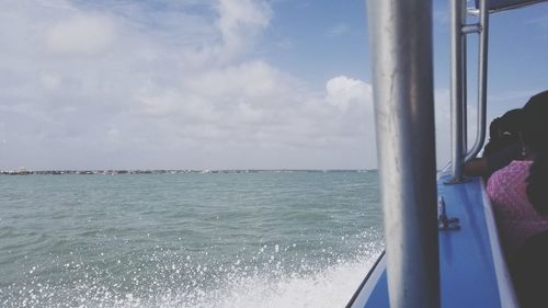 Scenic view of sea against sky seen through window