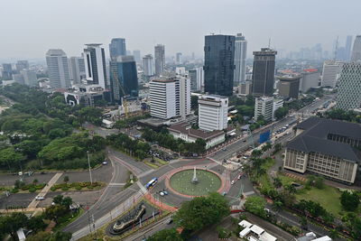 High angle view of street amidst buildings in city