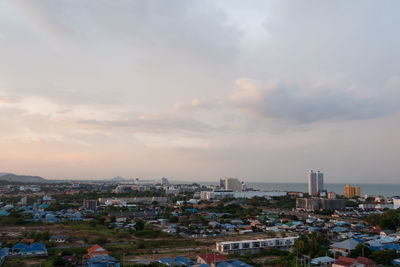 High angle view of city at sunset