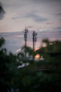 Communications tower against sky at dusk