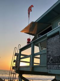 Built structure against clear sky at sunset