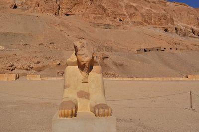 Sculpture of statues in desert