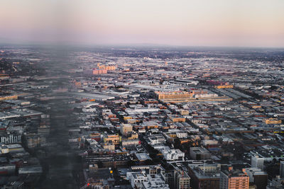 High angle view of city buildings during sunset