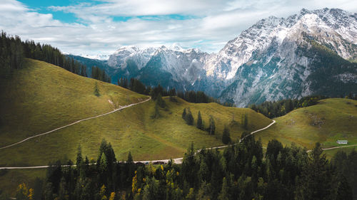 Scenic view of landscape and mountains against sky