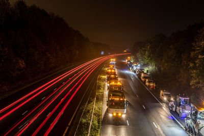 High angle view of light trails on road at night