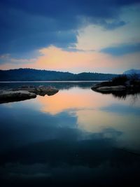 Scenic view of lake against sky during sunset