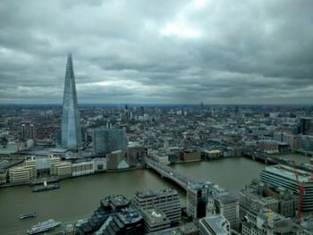 Cityscape against cloudy sky