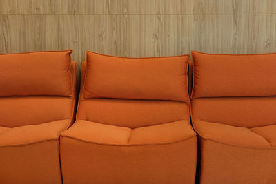 Close-up of sofa against wall