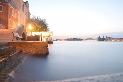 View of city lit up at waterfront