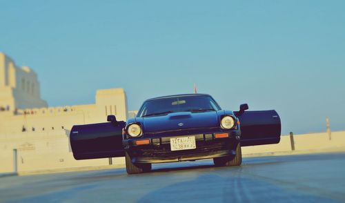 Vintage car against clear blue sky