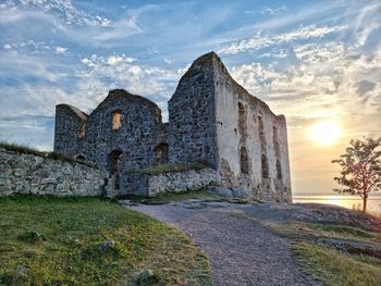 Low angle view of historic building against sky during sunset