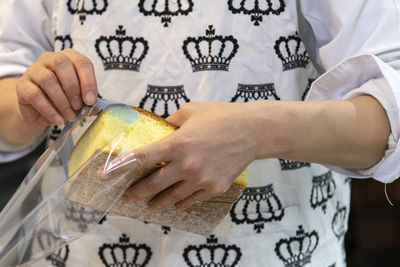 Midsection of woman holding ice cream
