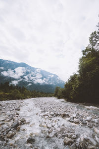 Scenic view of landscape and mountains against sky