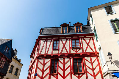 Low angle view of red building against sky