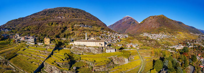 Scenic view of mountains against clear blue sky