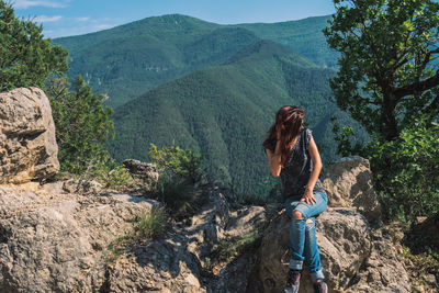 Woman looking at waterfall