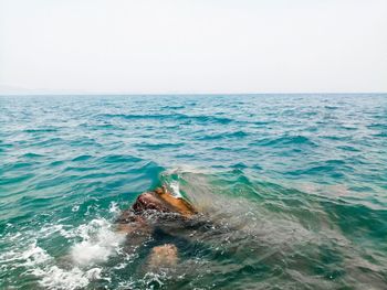 Scenic view of sea against clear sky