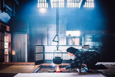 Man photographing illuminated on table