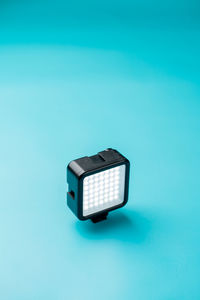 A mini led lamp on light blue background