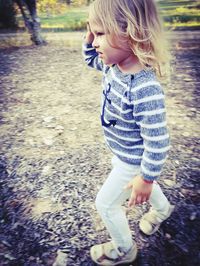 Full length of cute baby girl standing on land