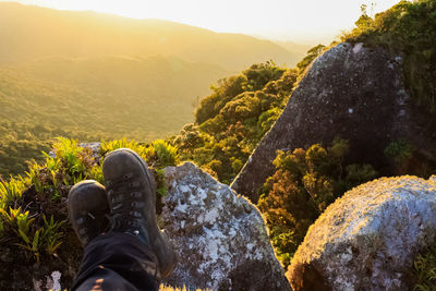 Low section of person on rock