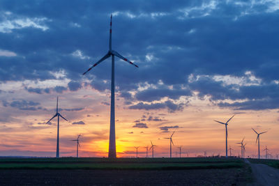 Wind turbines at sunset in austria