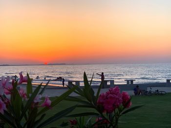 Scenic view of sea against orange sky