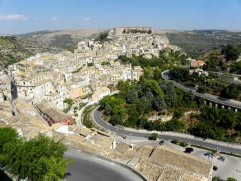 High angle view of road amidst buildings in town