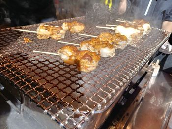 High angle view of meat on barbecue grill