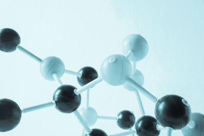 Close-up of atoms against white background