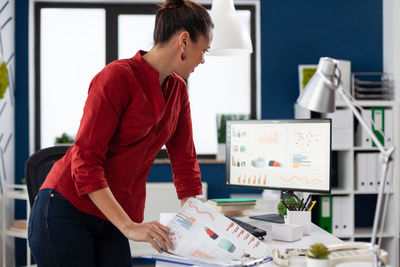 Side view of man working in office