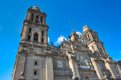 Low angle view of historic building against clear blue sky