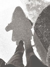 Low section of man standing on street