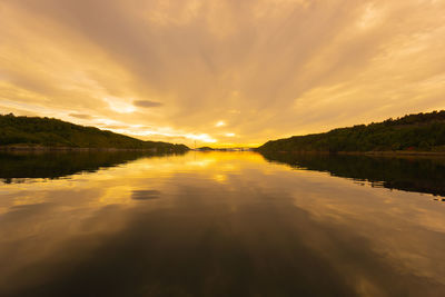 Scenic view of lake against sky during sunset