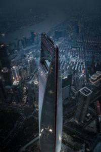 High angle view of illuminated city buildings at night