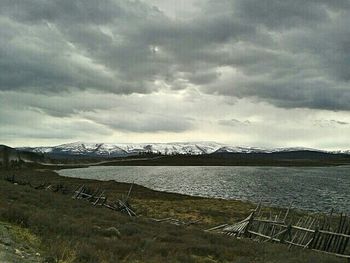 Scenic view of mountains against cloudy sky