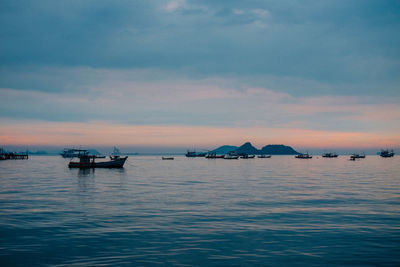 Scenic view of sea against sky at sunset