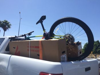 Low angle view of bicycle against clear blue sky