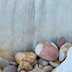 Close up of rounded and polished beach rocks on the sea shore