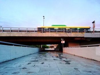 View of bridge in city against sky