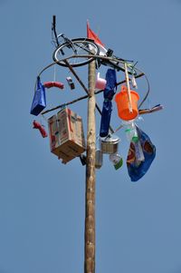 Low angle view of pole against clear blue sky