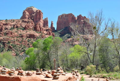 Panoramic view of rocks and trees against sky