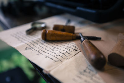 Close-up of hand tools on paper at table